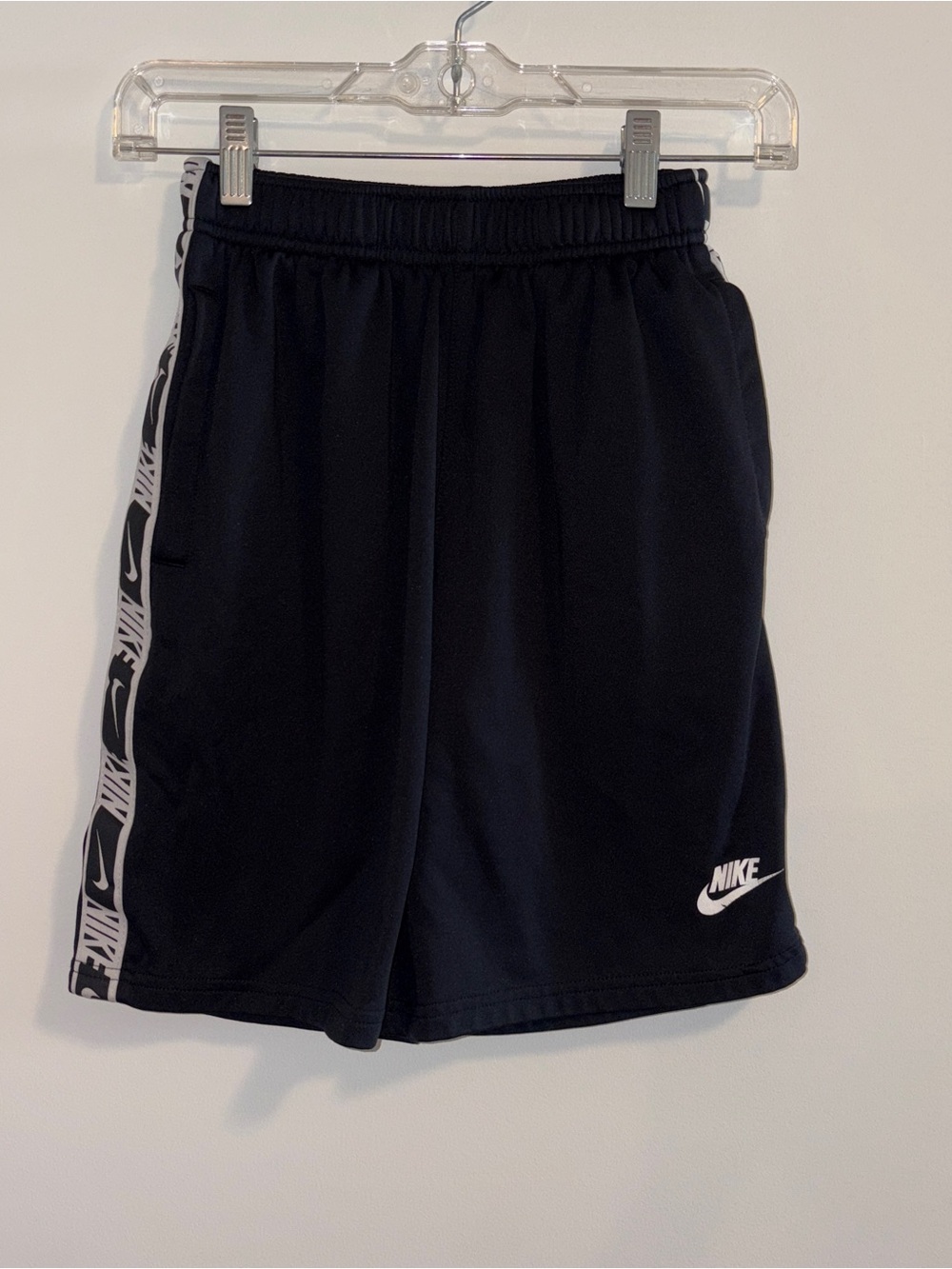 Nike Black Athletic Shorts with White Logo and Side Tape